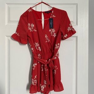 One clothing romper - never worn with tags- size small
